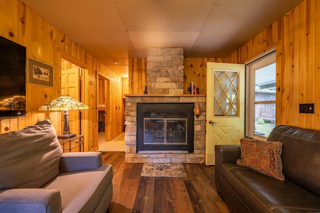 40936 Yost Rd, Emily, MN 56447 - living area with wooden walls, wood finished floors, and a fireplace