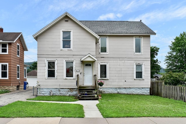 159 King St, Winona, MN 55987 - view of front of house with a shingled roof, a detached garage, and an outdoor structure