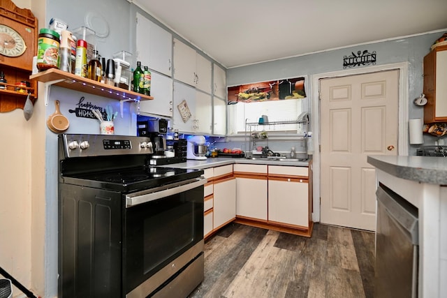 159 King St, Winona, MN 55987 - kitchen featuring appliances with stainless steel finishes, dark wood-type flooring, and white cabinets