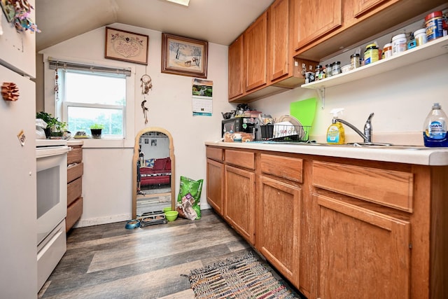 159 King St, Winona, MN 55987 - kitchen featuring wood finished floors, light countertops, open shelves, electric range, and brown cabinets