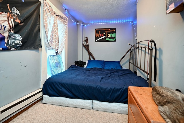 159 King St, Winona, MN 55987 - bedroom featuring a baseboard heating unit and a textured ceiling