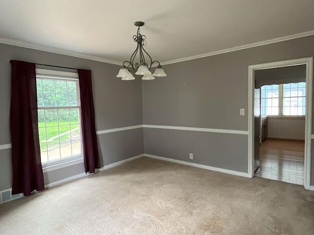 1304 3rd St NW, Austin, MN 55912 - carpeted empty room with a chandelier and ornamental molding