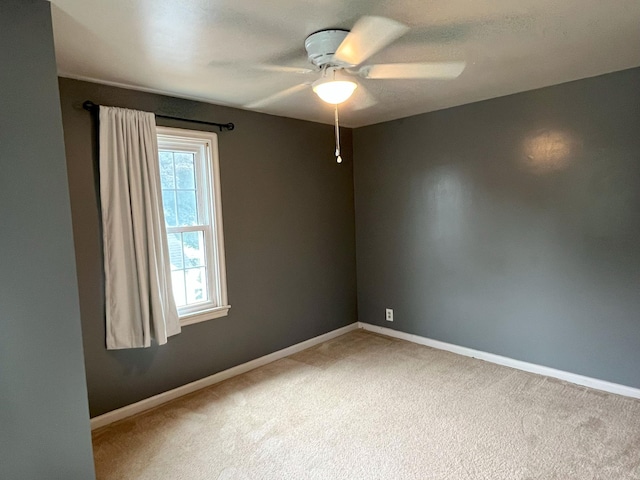 1304 3rd St NW, Austin, MN 55912 - carpeted empty room with baseboards and ceiling fan