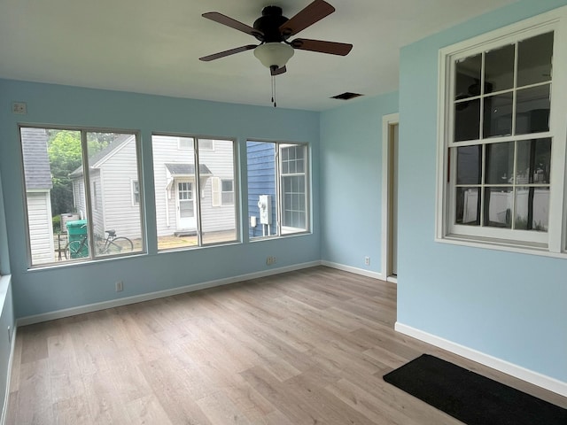 1304 3rd St NW, Austin, MN 55912 - unfurnished room with light wood-type flooring and a ceiling fan