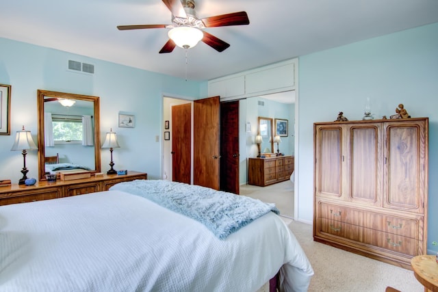 715 River Heights Rd SW, Menomonie, WI 54751 - bedroom with light carpet, a closet, and ceiling fan