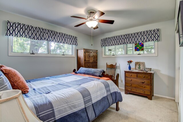 715 River Heights Rd SW, Menomonie, WI 54751 - bedroom featuring light colored carpet and ceiling fan