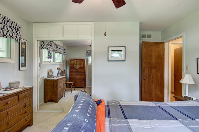 715 River Heights Rd SW, Menomonie, WI 54751 - bedroom featuring light carpet, a closet, and a ceiling fan