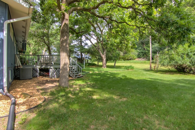 715 River Heights Rd SW, Menomonie, WI 54751 - view of grassy yard featuring a wooden deck and stairway