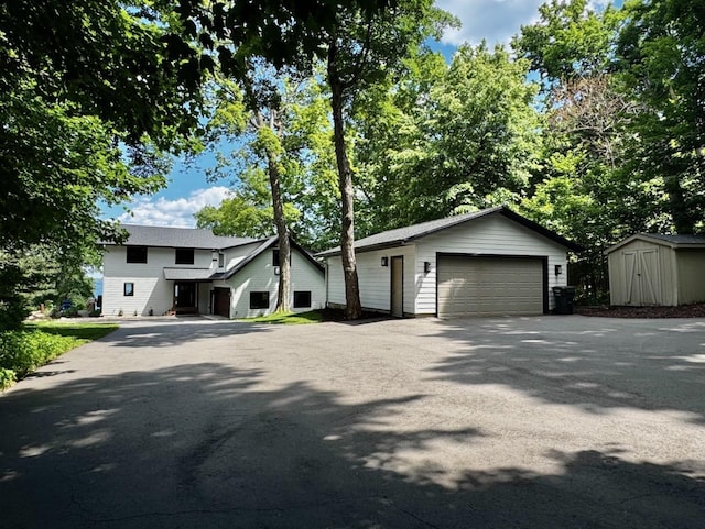 8766 Interlachen Rd, Lake Shore, MN 56468 - view of front facade featuring a garage and a shed