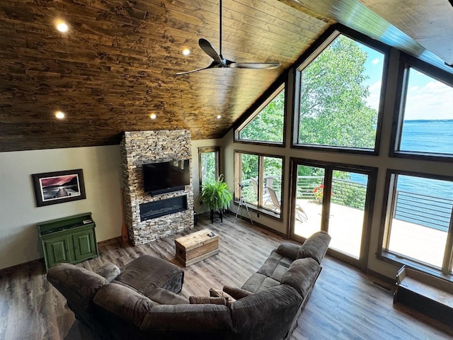 8766 Interlachen Rd, Lake Shore, MN 56468 - living area with healthy amount of natural light, wooden ceiling, high vaulted ceiling, a ceiling fan, and a stone fireplace