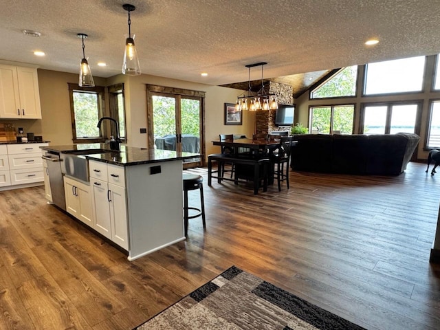 8766 Interlachen Rd, Lake Shore, MN 56468 - kitchen with dark countertops, stainless steel dishwasher, a textured ceiling, recessed lighting, and white cabinetry