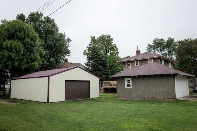 605 Chestnut St, Ellsworth, MN 56129 - view of grassy yard with a garage and an outbuilding