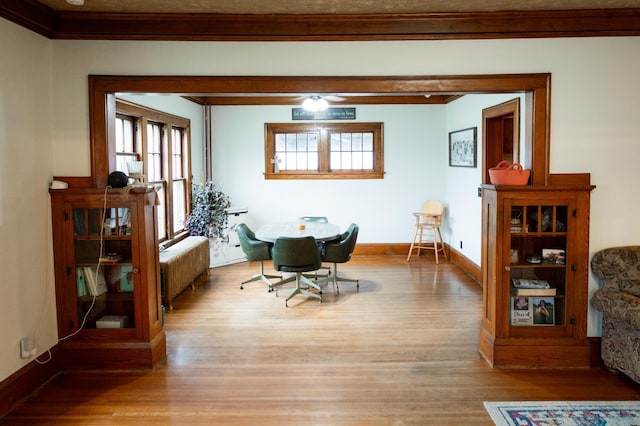 605 Chestnut St, Ellsworth, MN 56129 - dining space with radiator, ornamental molding, light wood finished floors, and healthy amount of natural light