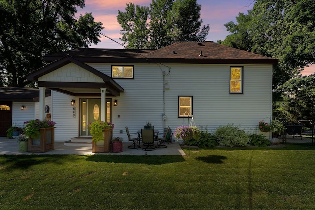640 3rd St N, Dassel, MN 55325 - back of house with a lawn and a patio