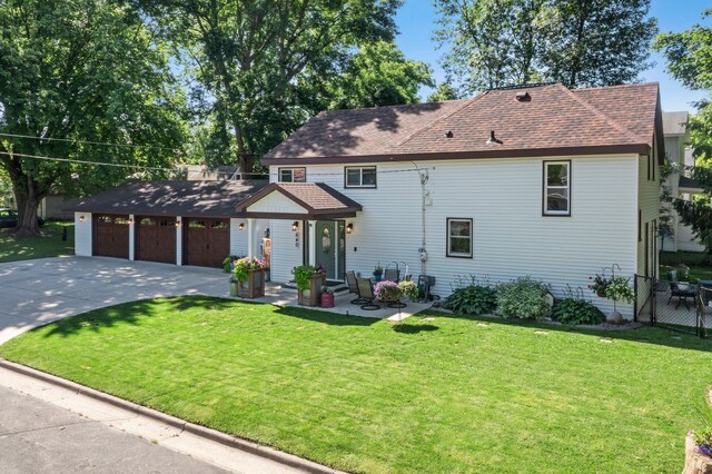 640 3rd St N, Dassel, MN 55325 - view of front of home with a garage, driveway, and roof with shingles