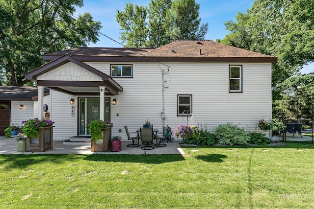 640 3rd St N, Dassel, MN 55325 - back of house featuring a yard, a patio, and roof with shingles