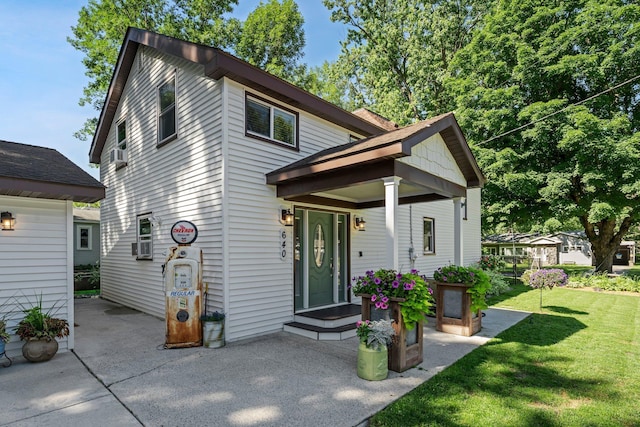 640 3rd St N, Dassel, MN 55325 - view of front of home featuring a front lawn and a patio area