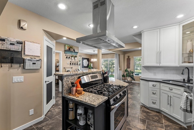 640 3rd St N, Dassel, MN 55325 - kitchen featuring gas stove, island range hood, decorative backsplash, recessed lighting, and glass insert cabinets