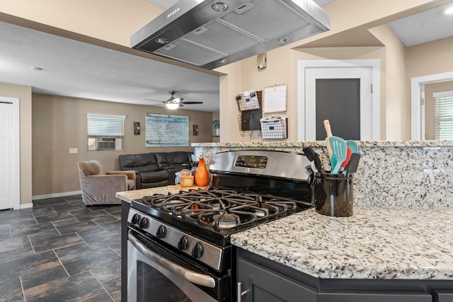 640 3rd St N, Dassel, MN 55325 - kitchen featuring stainless steel gas range, ventilation hood, light stone counters, ceiling fan, and cooling unit