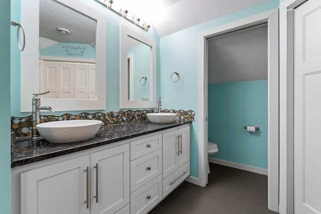 640 3rd St N, Dassel, MN 55325 - full bath with double vanity, tile patterned floors, and a textured ceiling