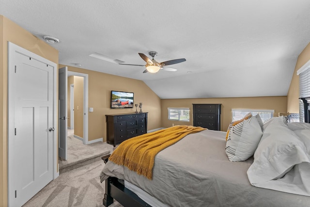 640 3rd St N, Dassel, MN 55325 - bedroom with light carpet, a textured ceiling, ceiling fan, and vaulted ceiling