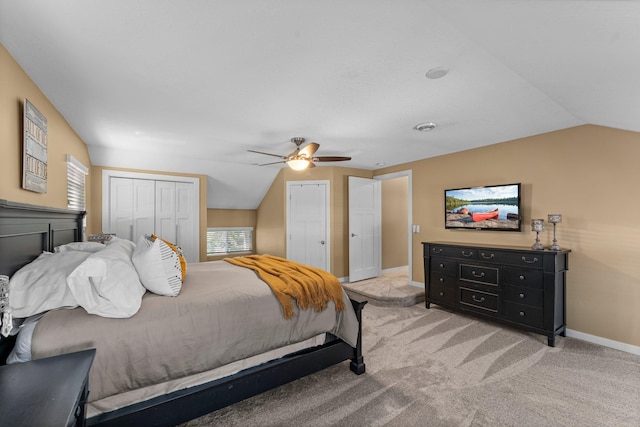 640 3rd St N, Dassel, MN 55325 - bedroom featuring lofted ceiling, light carpet, two closets, a ceiling fan, and multiple windows
