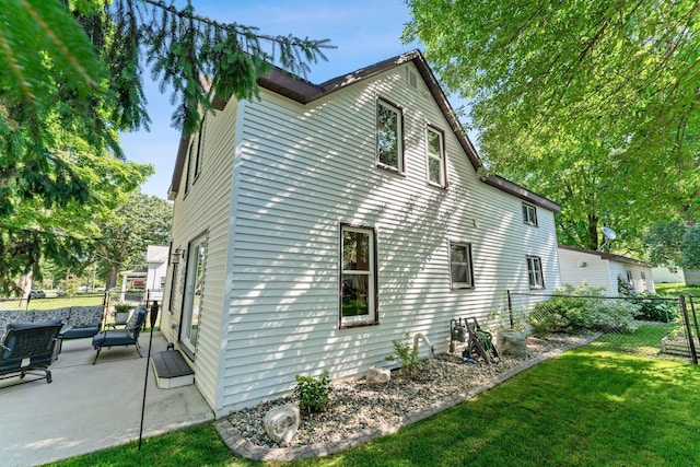 640 3rd St N, Dassel, MN 55325 - view of side of home featuring a patio area