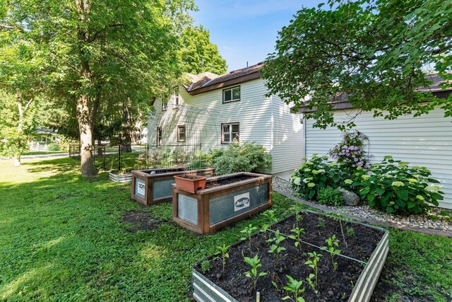 640 3rd St N, Dassel, MN 55325 - view of grassy yard with a garden