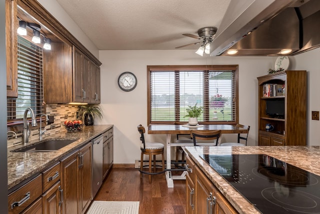 102 Terrace Vw E, Decoria Twp, MN 56001 - kitchen featuring black electric stovetop, stainless steel dishwasher, a ceiling fan, dark wood-type flooring, and backsplash