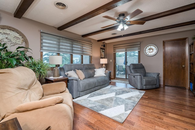 102 Terrace Vw E, Decoria Twp, MN 56001 - living room with beamed ceiling, a ceiling fan, and wood finished floors
