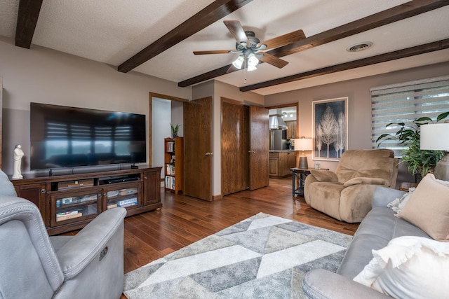 102 Terrace Vw E, Decoria Twp, MN 56001 - living area featuring beam ceiling, a ceiling fan, and wood finished floors