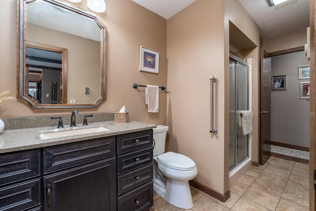 102 Terrace Vw E, Decoria Twp, MN 56001 - bathroom with vanity, a stall shower, tile patterned flooring, and a textured ceiling
