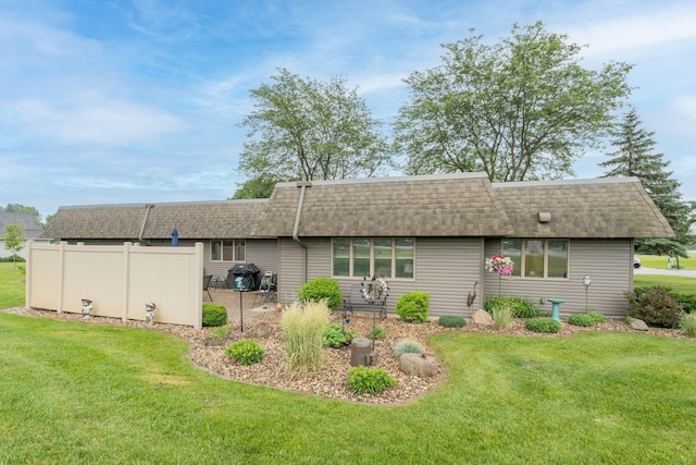 102 Terrace Vw E, Decoria Twp, MN 56001 - back of property featuring roof with shingles, a yard, and mansard roof