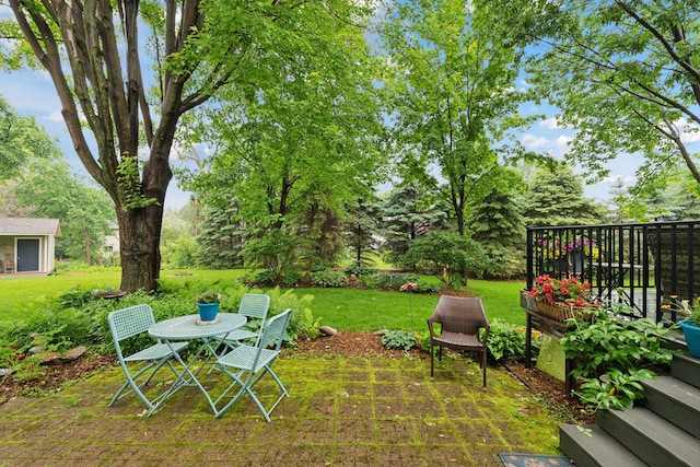 1378 Dunsmore Dr, Waconia, MN 55387 - view of grassy yard featuring a patio area