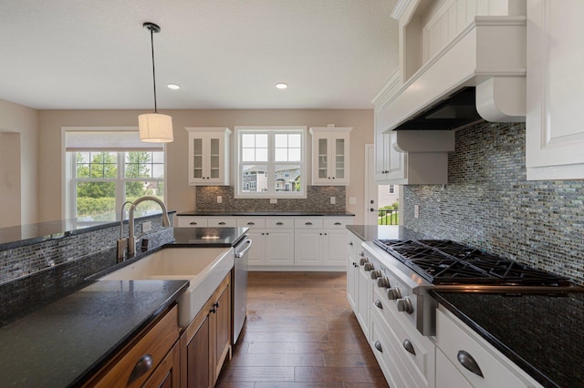 6430 Bluestem Cir, Corcoran, MN 55340 - kitchen with stainless steel appliances, decorative backsplash, healthy amount of natural light, glass insert cabinets, and recessed lighting
