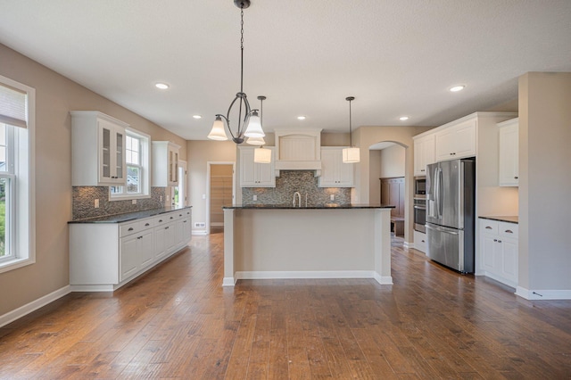 6430 Bluestem Cir, Corcoran, MN 55340 - kitchen with appliances with stainless steel finishes, dark countertops, backsplash, white cabinets, and recessed lighting