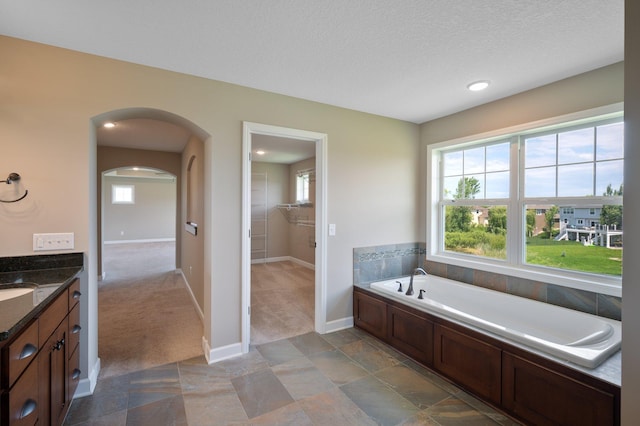 6430 Bluestem Cir, Corcoran, MN 55340 - full bath with a bath, vanity, recessed lighting, and a textured ceiling