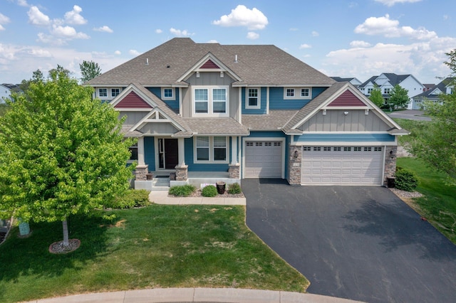 6430 Bluestem Cir, Corcoran, MN 55340 - craftsman inspired home with board and batten siding, driveway, stone siding, and a shingled roof