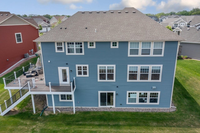 6430 Bluestem Cir, Corcoran, MN 55340 - rear view of house featuring a lawn, a wooden deck, and a residential view