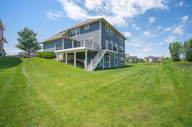 6430 Bluestem Cir, Corcoran, MN 55340 - back of house featuring stairs, a wooden deck, and a yard