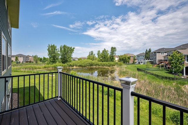 6430 Bluestem Cir, Corcoran, MN 55340 - deck featuring a residential view, a water view, and a lawn