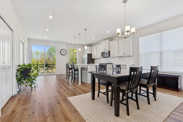 6645 Jody Ave S, Cottage Grove, MN 55016 - dining space featuring a chandelier, light wood-style flooring, and recessed lighting