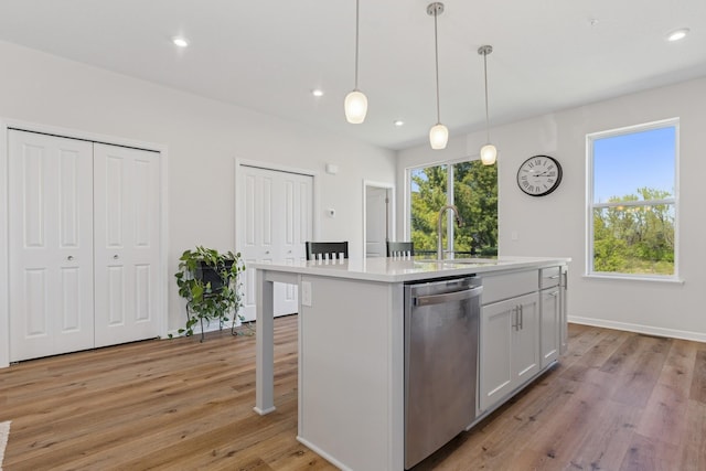 6645 Jody Ave S, Cottage Grove, MN 55016 - kitchen with stainless steel dishwasher, light countertops, light wood-style flooring, an island with sink, and recessed lighting