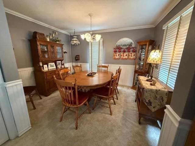 688 Miller Ave, Windom, MN 56101 - dining area with a chandelier, wainscoting, and crown molding