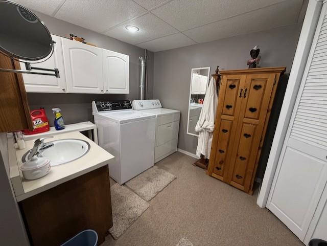 688 Miller Ave, Windom, MN 56101 - washroom featuring washer and dryer and light carpet
