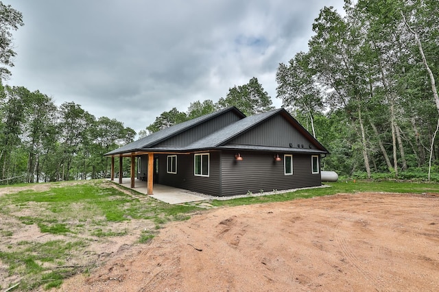 19566 Early Bird Dr, Park Rapids, MN 56470 - view of side of property with a patio area