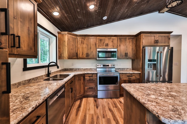 19566 Early Bird Dr, Park Rapids, MN 56470 - kitchen with stainless steel appliances, vaulted ceiling, light wood-style flooring, wood ceiling, and light stone countertops