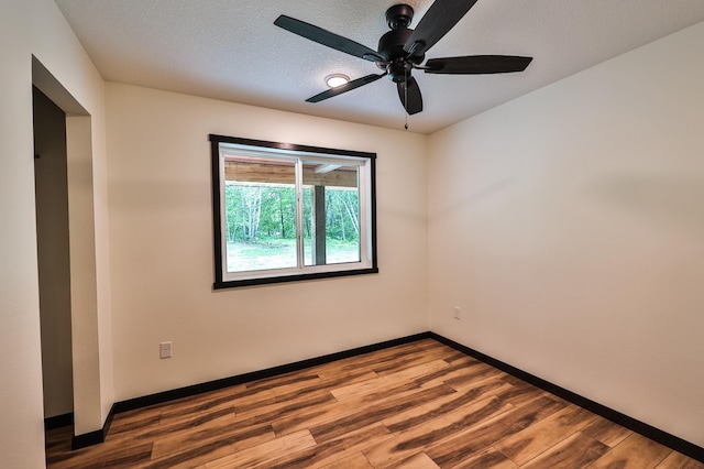 19566 Early Bird Dr, Park Rapids, MN 56470 - spare room featuring ceiling fan and wood finished floors