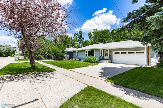 420 17th St S, Moorhead, MN 56560 - ranch-style house featuring driveway, an attached garage, and a chimney
