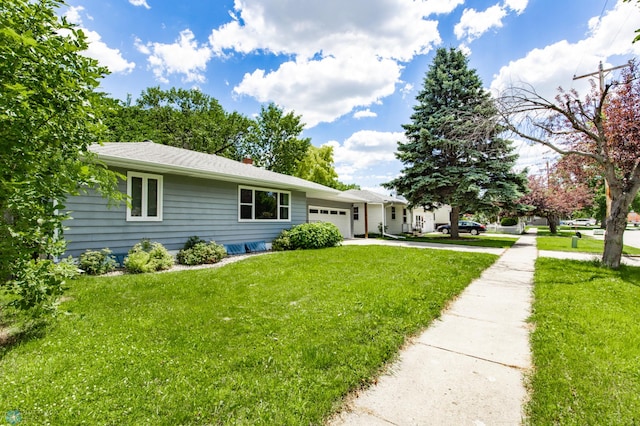 420 17th St S, Moorhead, MN 56560 - ranch-style home with an attached garage, concrete driveway, a front yard, and a chimney